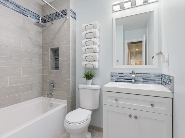 full bathroom with shower / tub combination, toilet, vanity, baseboards, and backsplash