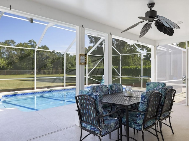 outdoor pool featuring a patio area, a lanai, and a ceiling fan