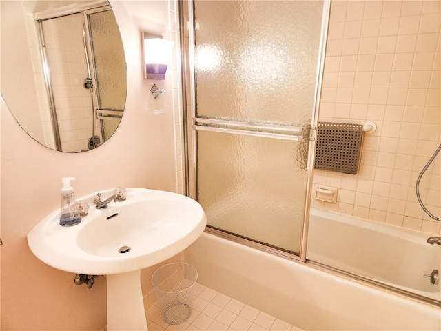 bathroom with tile patterned flooring and enclosed tub / shower combo