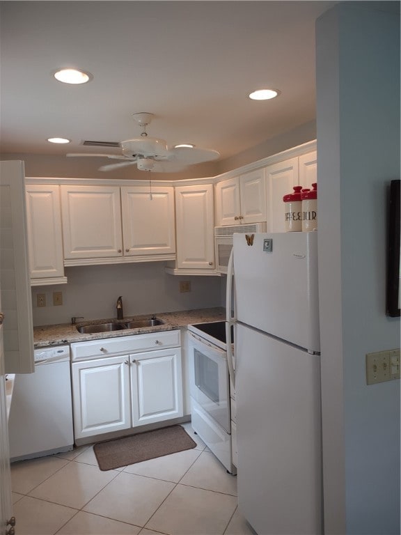 kitchen with sink, light tile patterned floors, ceiling fan, white cabinetry, and white appliances