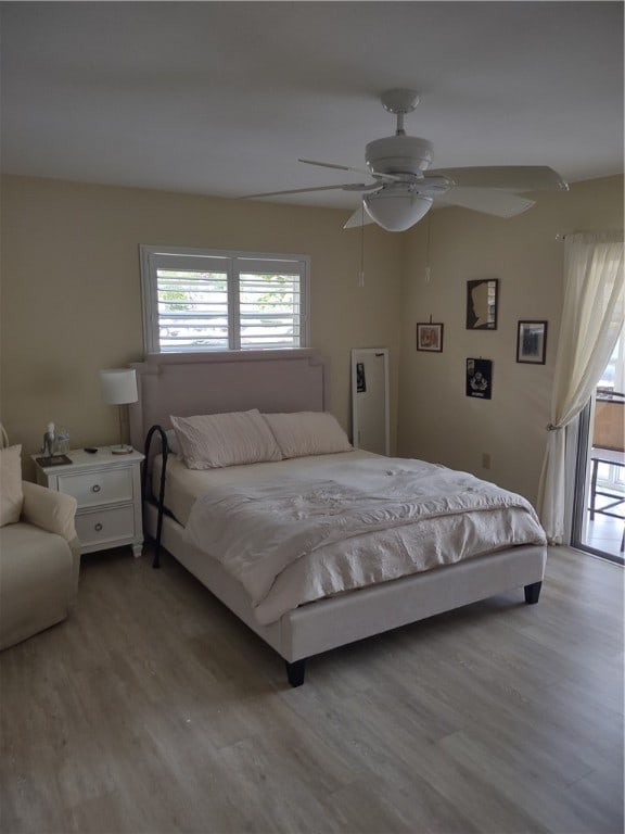 bedroom featuring light hardwood / wood-style floors and ceiling fan