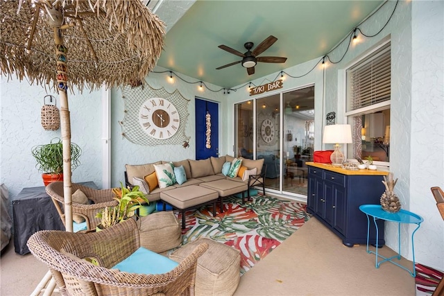 carpeted living room with ceiling fan