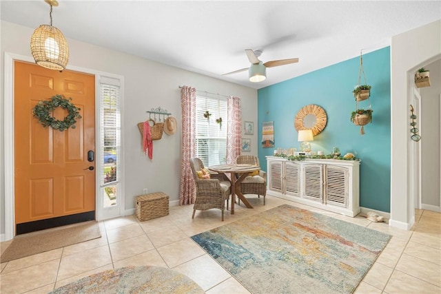 entryway with ceiling fan and light tile patterned floors