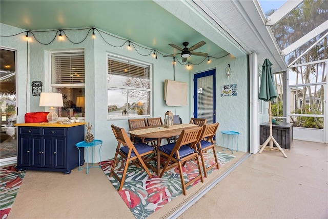 dining space featuring ceiling fan and lofted ceiling with skylight