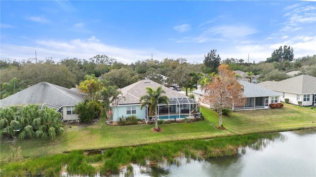 birds eye view of property with a water view