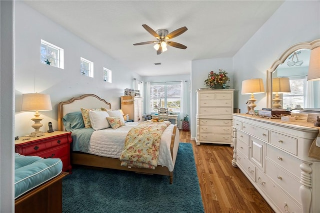 bedroom with ceiling fan and hardwood / wood-style floors