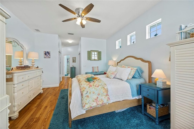 bedroom featuring ceiling fan and light hardwood / wood-style floors