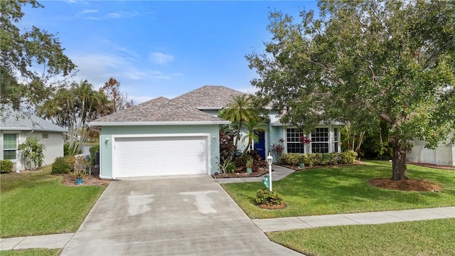 view of front of house featuring a garage and a front lawn