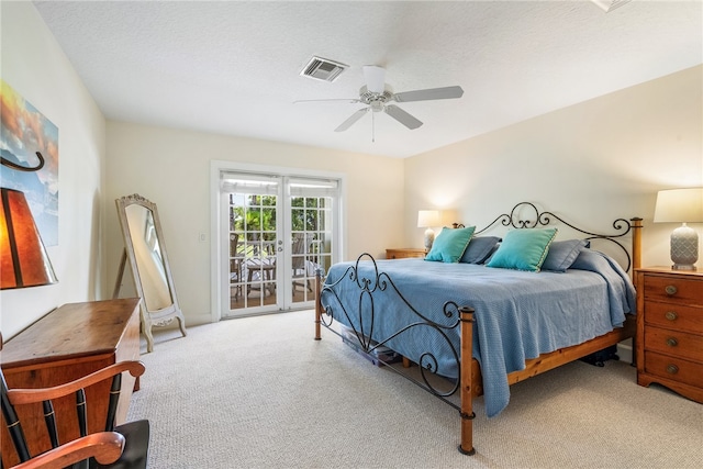 carpeted bedroom with ceiling fan, a textured ceiling, french doors, and access to outside