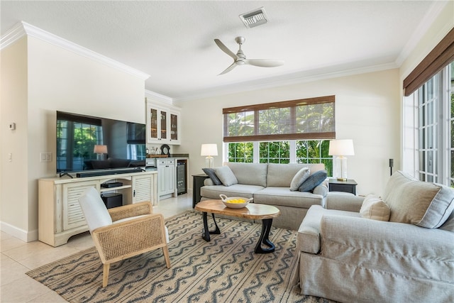 living room featuring ornamental molding, ceiling fan, beverage cooler, and light tile patterned flooring