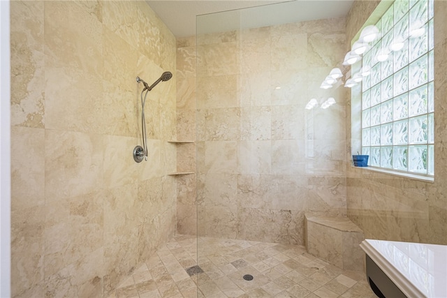 bathroom with tiled shower