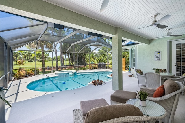 view of swimming pool featuring a patio, a lanai, ceiling fan, and an in ground hot tub