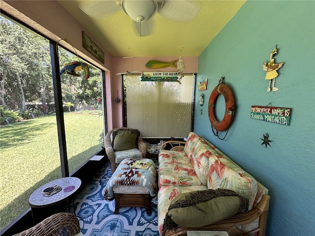 sunroom / solarium with ceiling fan