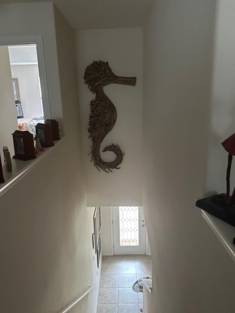 staircase with tile patterned floors