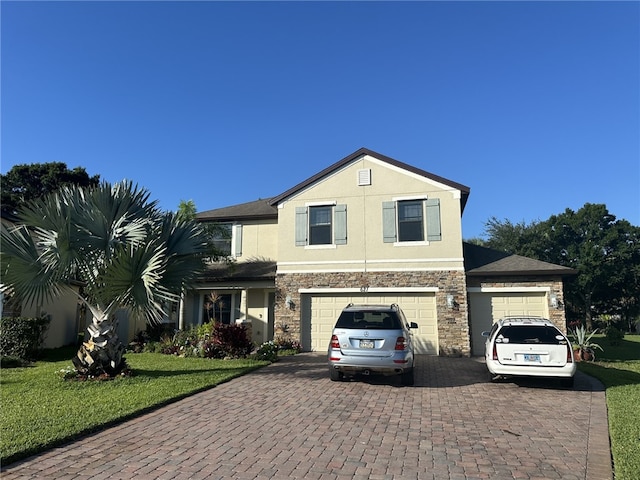 view of front facade featuring a garage and a front yard