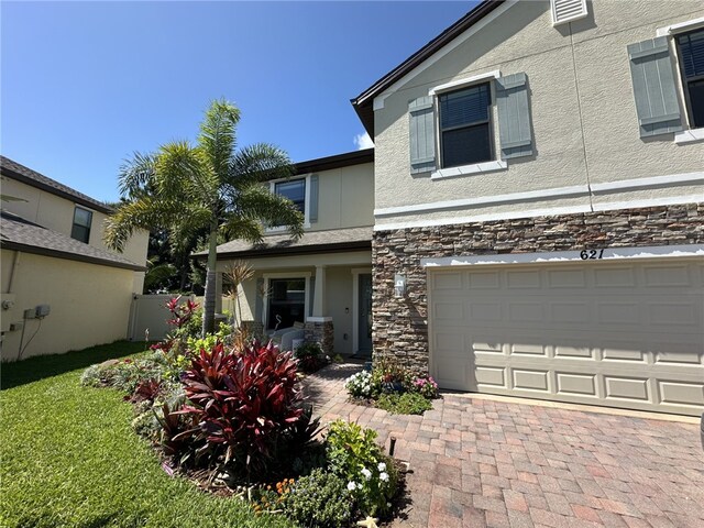 view of front of property with a garage