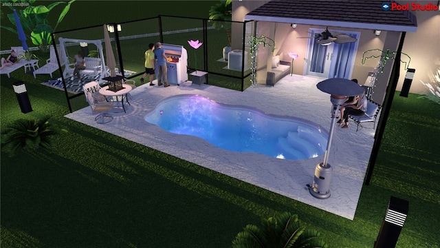 view of pool with a yard and a patio area