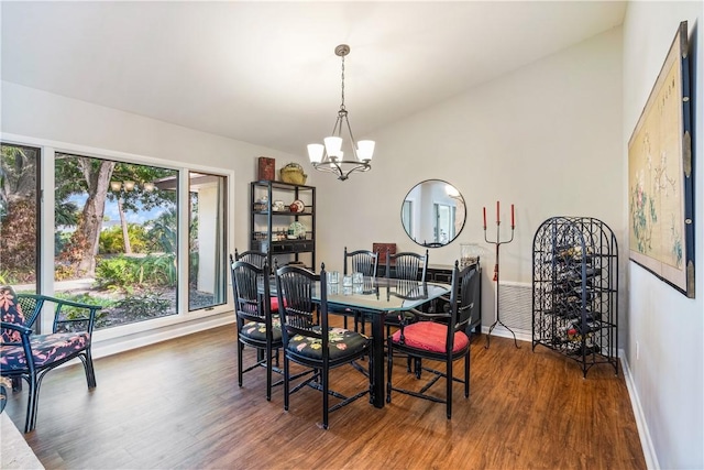 240 44th Ter SW, Vero Beach, FL 32968 - dining room with a chandelier, wood finished floors, and baseboards