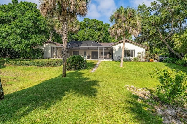 240 44th Ter SW, Vero Beach, FL 32968 - view of green lawn with a lanai