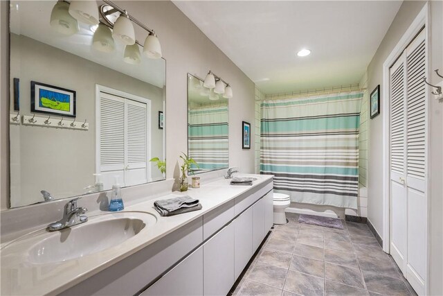 240 44th Ter SW, Vero Beach, FL 32968 - full bathroom featuring toilet, double vanity, a closet, curtained shower, and recessed lighting