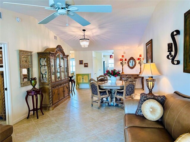 600 E Lake Jasmine Cir Unit 206, Vero Beach, FL 32962 - dining room featuring vaulted ceiling, a ceiling fan, light tile patterned floors, and baseboards