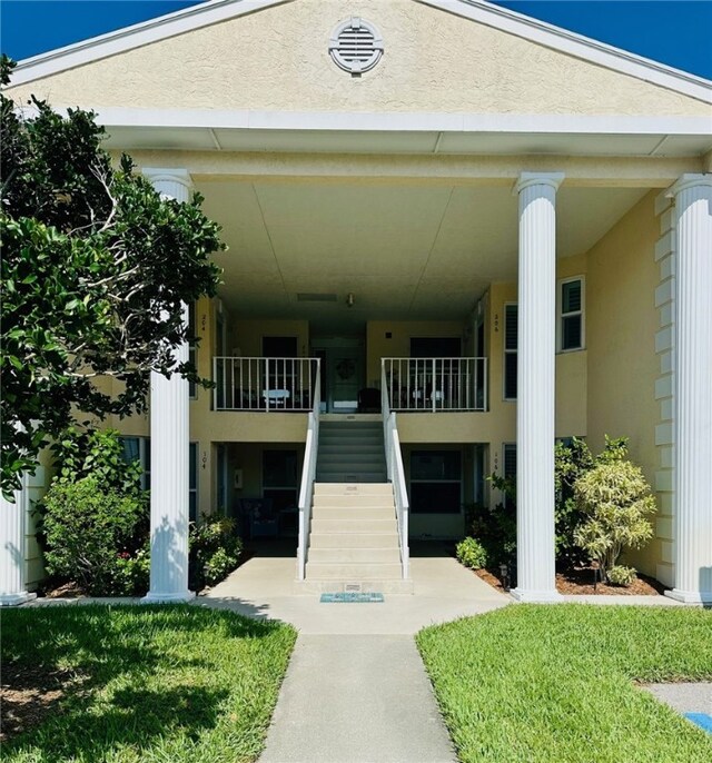 600 E Lake Jasmine Cir Unit 206, Vero Beach, FL 32962 - view of building exterior featuring stairs