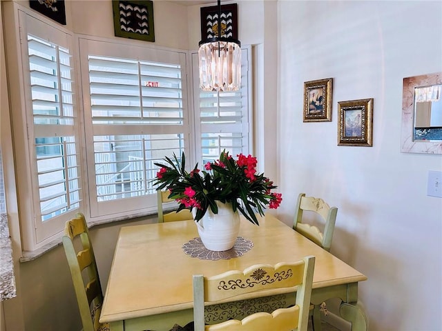 600 E Lake Jasmine Cir Unit 206, Vero Beach, FL 32962 - dining room with a chandelier