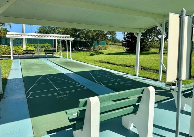 600 E Lake Jasmine Cir Unit 206, Vero Beach, FL 32962 - view of community with a lawn and shuffleboard