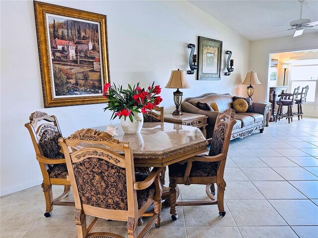600 E Lake Jasmine Cir Unit 206, Vero Beach, FL 32962 - dining room featuring a ceiling fan, light tile patterned floors, lofted ceiling, and baseboards