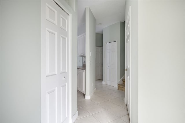 hallway with light tile patterned floors