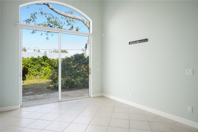 doorway with light tile patterned floors