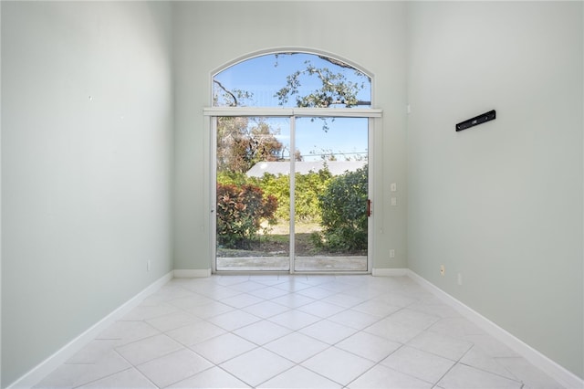 spare room featuring light tile patterned floors