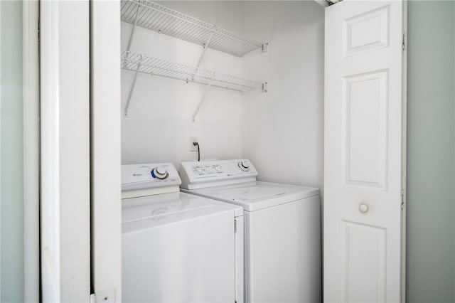 laundry room featuring separate washer and dryer