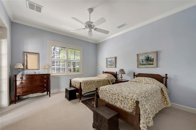 carpeted bedroom featuring ceiling fan and crown molding