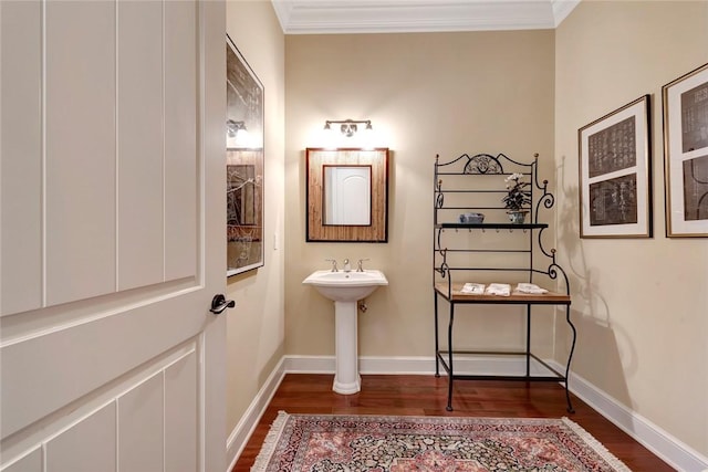 bathroom with hardwood / wood-style floors and ornamental molding