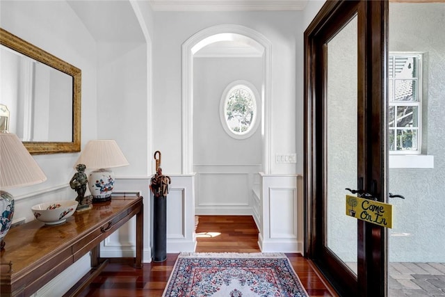 entryway featuring dark hardwood / wood-style floors and ornamental molding