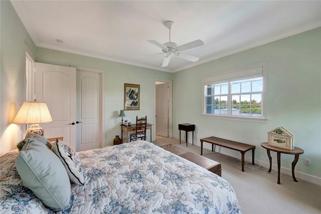 carpeted bedroom with ceiling fan and crown molding