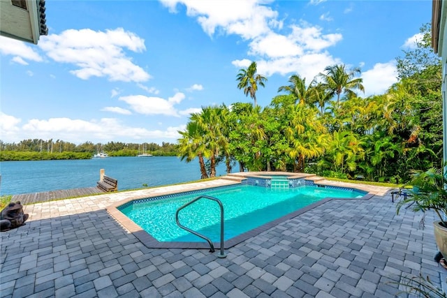 view of swimming pool with a water view, an in ground hot tub, and a patio