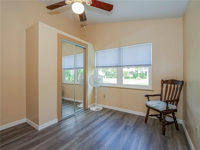 sitting room featuring wood finished floors and baseboards