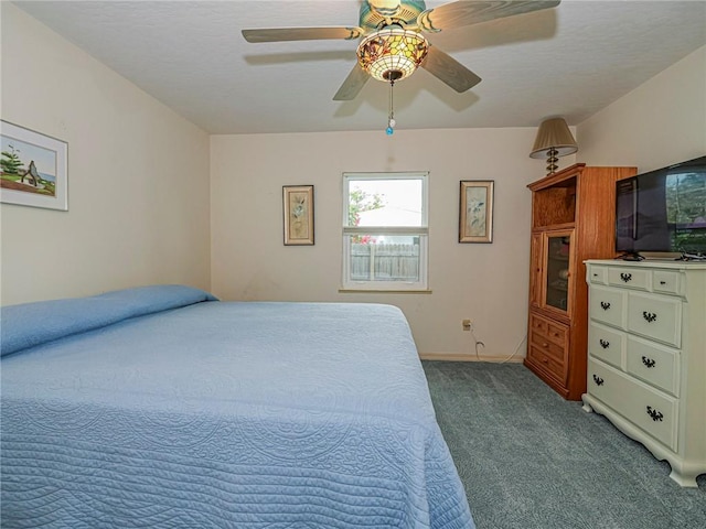 carpeted bedroom featuring a ceiling fan