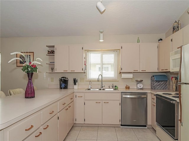 kitchen with white appliances, light tile patterned floors, light countertops, open shelves, and a sink