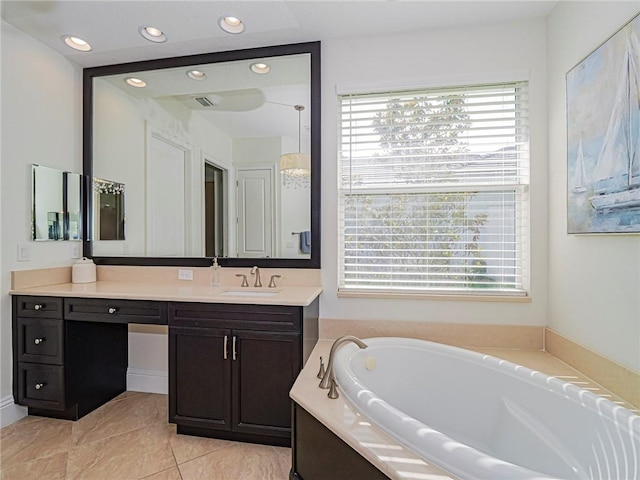 4520 Jacqueline Mnr, Vero Beach, FL 32968 - bathroom with a bath, vanity, and recessed lighting