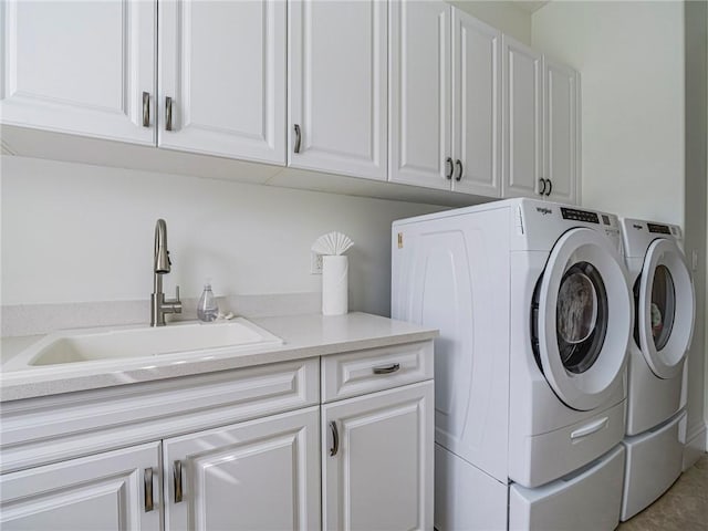 4520 Jacqueline Mnr, Vero Beach, FL 32968 - laundry room featuring cabinet space and washer and dryer