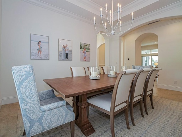 4520 Jacqueline Mnr, Vero Beach, FL 32968 - dining room with arched walkways, ornamental molding, light tile patterned floors, a chandelier, and a tray ceiling
