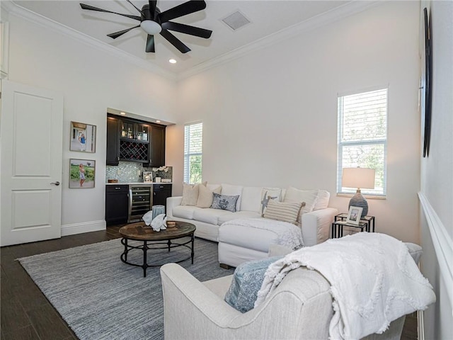 4520 Jacqueline Mnr, Vero Beach, FL 32968 - living area with beverage cooler, a bar, ceiling fan, crown molding, and recessed lighting