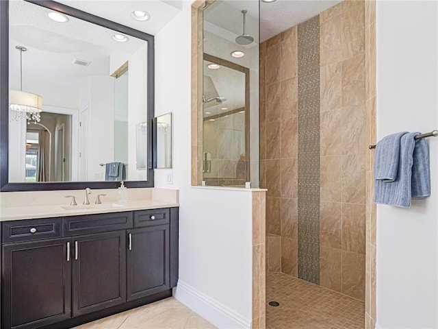 4520 Jacqueline Mnr, Vero Beach, FL 32968 - bathroom with a tile shower, vanity, tile patterned flooring, and recessed lighting