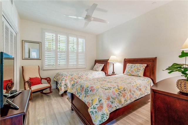 1510 Oak Harbor Blvd Unit 102, Vero Beach, FL 32967 - bedroom with wood-type flooring, a ceiling fan, and a closet