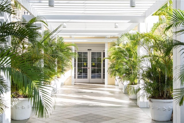 1510 Oak Harbor Blvd Unit 102, Vero Beach, FL 32967 - doorway to property featuring french doors and a pergola