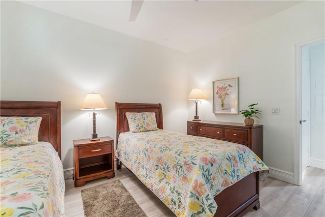 1510 Oak Harbor Blvd Unit 102, Vero Beach, FL 32967 - bedroom with light wood-type flooring, baseboards, and ceiling fan