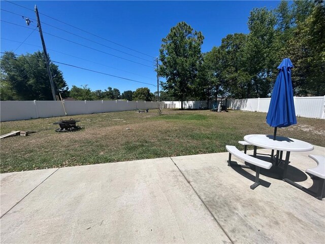 view of yard with a fenced backyard and a patio area